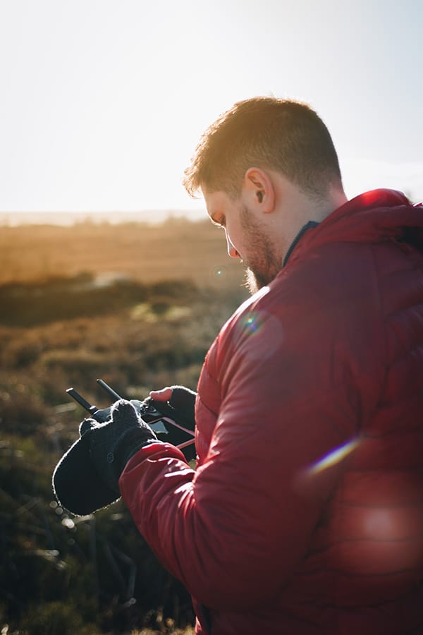 Man operating drone